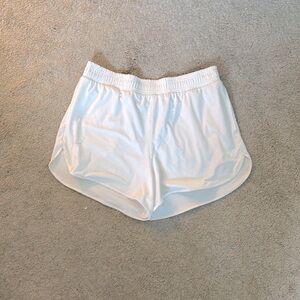 White/cream all in motion active shorts.